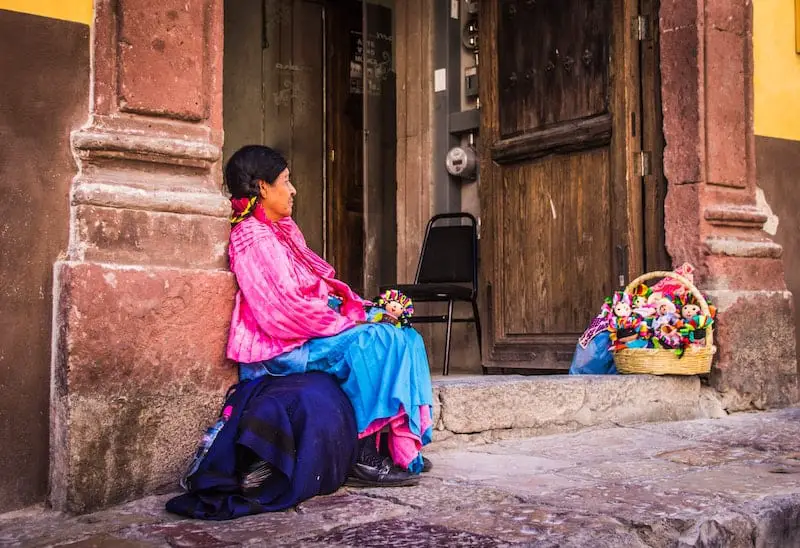 mexican woman sitting on the steps