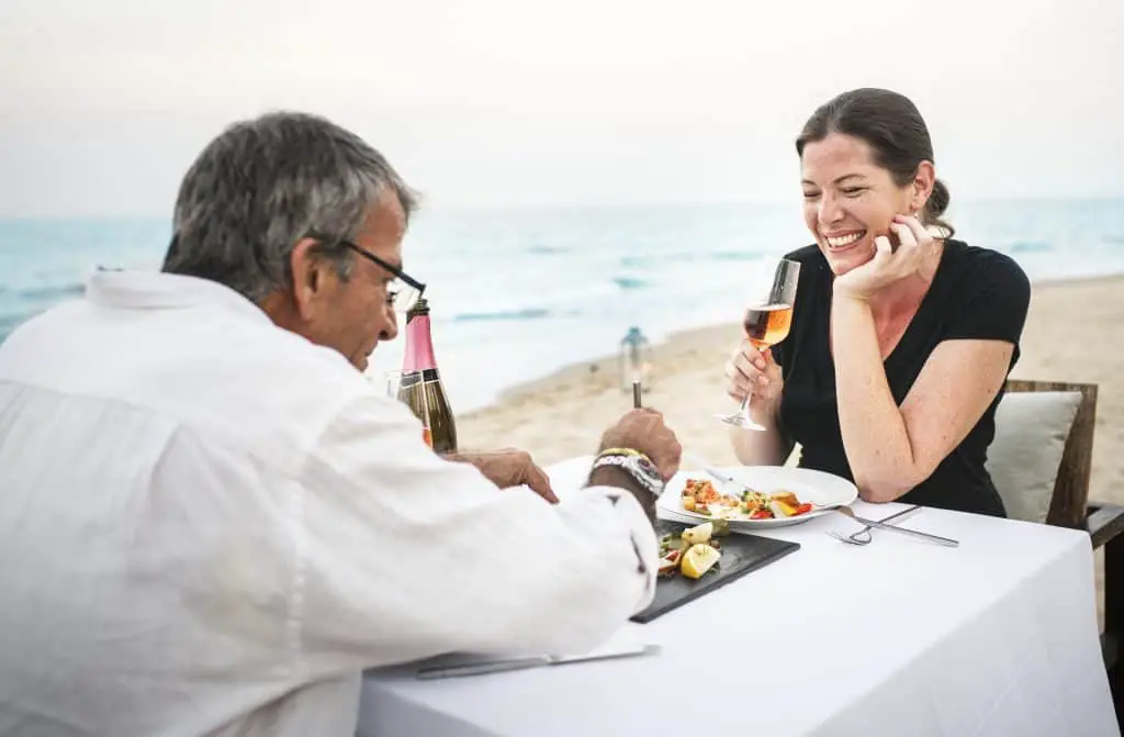 couple served dinner at all inclusive resort